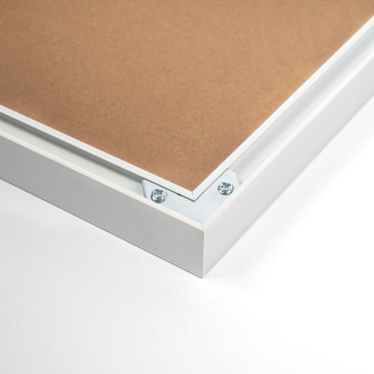 White aluminium picture frame with a minimalist design, clean lines, and a refined finish, suitable for displaying photos or art prints., back corner closeup picture