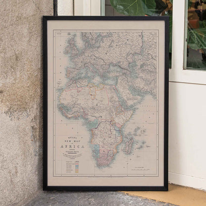 Wyld New Map of Africa vintage cartographic poster in beige grey blue and red tones, framed and displayed in home decor