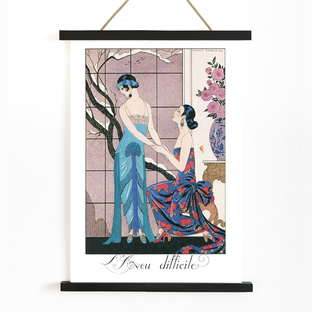 Art deco poster Laveu Difficile by George Barbier featuring two elegant women in colorful dresses in an interior setting, with wooden magnetic frame on white background