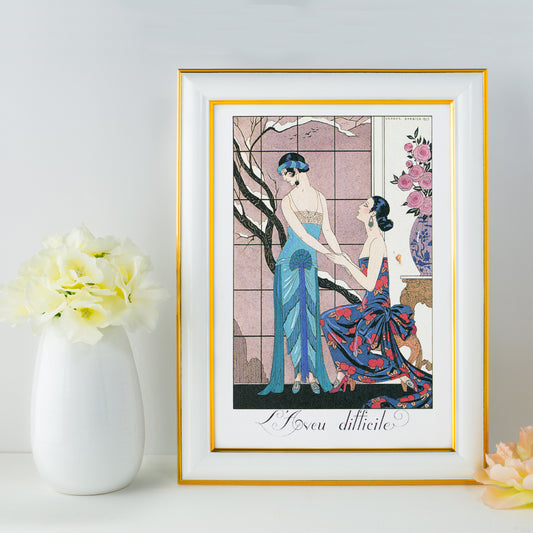 Art deco poster Laveu Difficile by George Barbier featuring two elegant women in colorful dresses in an interior setting, framed and displayed in home decor