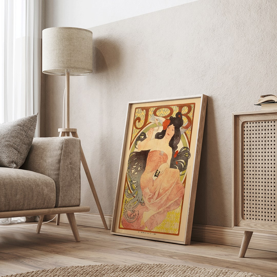 Art Nouveau poster by Alphonse Mucha featuring an elegant woman in a flowing dress with dark hair titled Job, framed and displayed in home decor