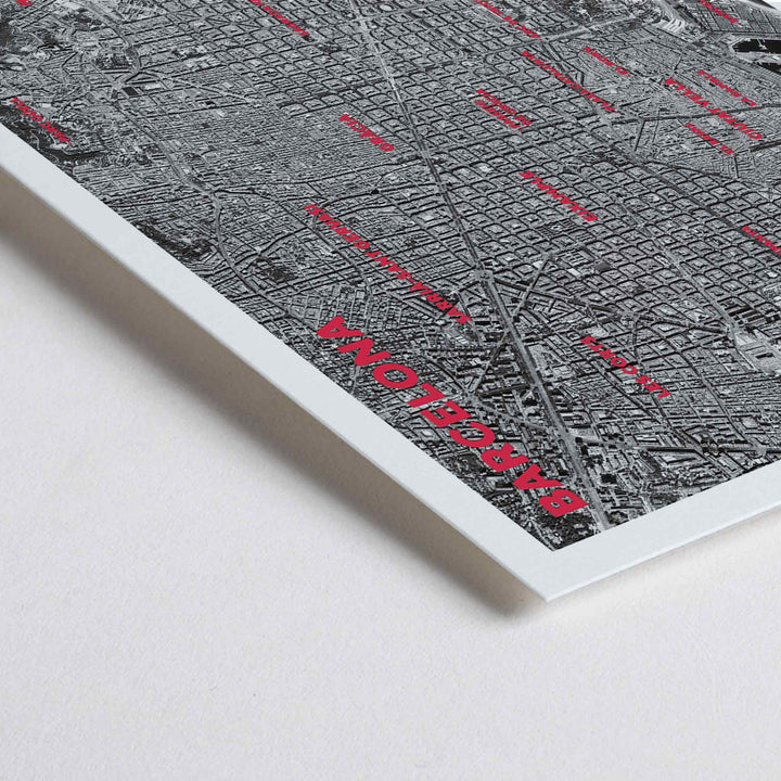 Closeup detail of Moryarty Barcelona satellite city map poster in bold black and white aerial style showing city grid districts landmarks monuments and coastline