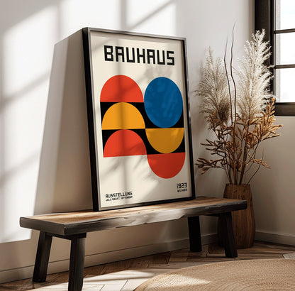 Bauhaus Poster 18 with bold geometric shapes in red blue and yellow on a white background minimalist design primary colors and Bauhaus text at the top, framed and displayed in home decor