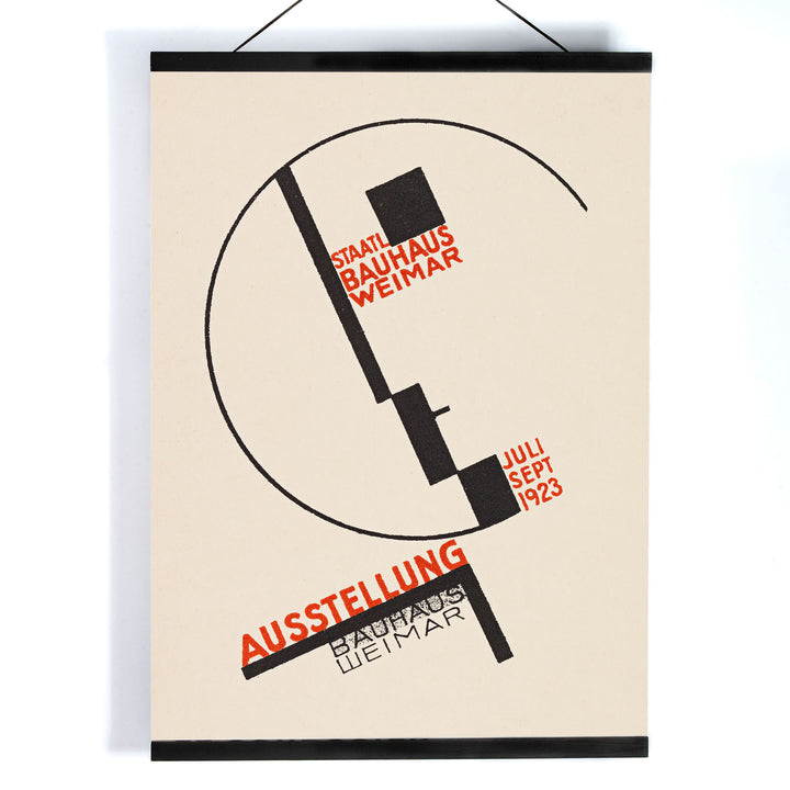 Dörte Helm Bauhaus Weimar exhibition poster with bold black geometry and red typography on warm beige background, with wooden magnetic frame on white background
