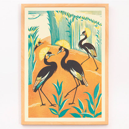 Colorful exotic birds and stylized plants in a jungle setting by Clifford Webb from A Jungle Picnic Pl15 poster with orange and green background, framed and displayed in modern living room decor
