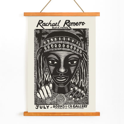 Black and white portrait block print poster with intricate patterns by Rachael Romero at Books and Co gallery, with wooden magnetic frame on white background