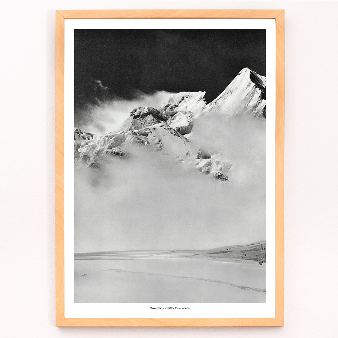 Broad Peak mountain view from Godwin-Austen Glacier snow-covered and obscured by clouds photo by Vittorio Sella, framed and displayed in modern living room decor