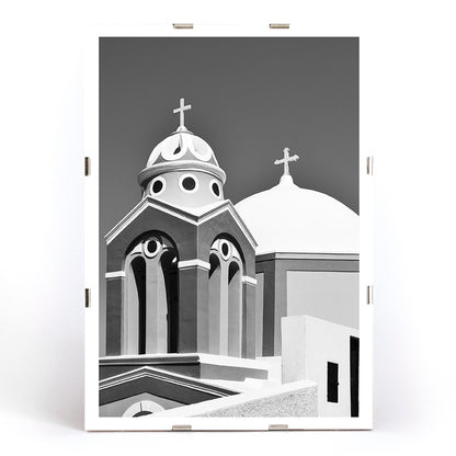 Black and white artwork of a traditional church dome and cross in Santorini Greece by artist Santorini Greece poster featuring classic architecture against a clear sky, framed and displayed in modern living room decor