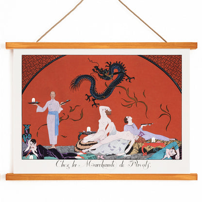 Opulent oriental scene with reclining figures and a blue dragon in Chez la Marchande de Pavots by George Barbier poster on a red background, with wooden magnetic frame on white background