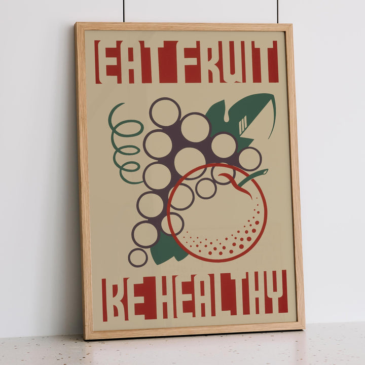 Work Projects Administration Eat Fruit Be Healthy poster with bold red type and stylized fruit, framed and displayed in modern living room decor