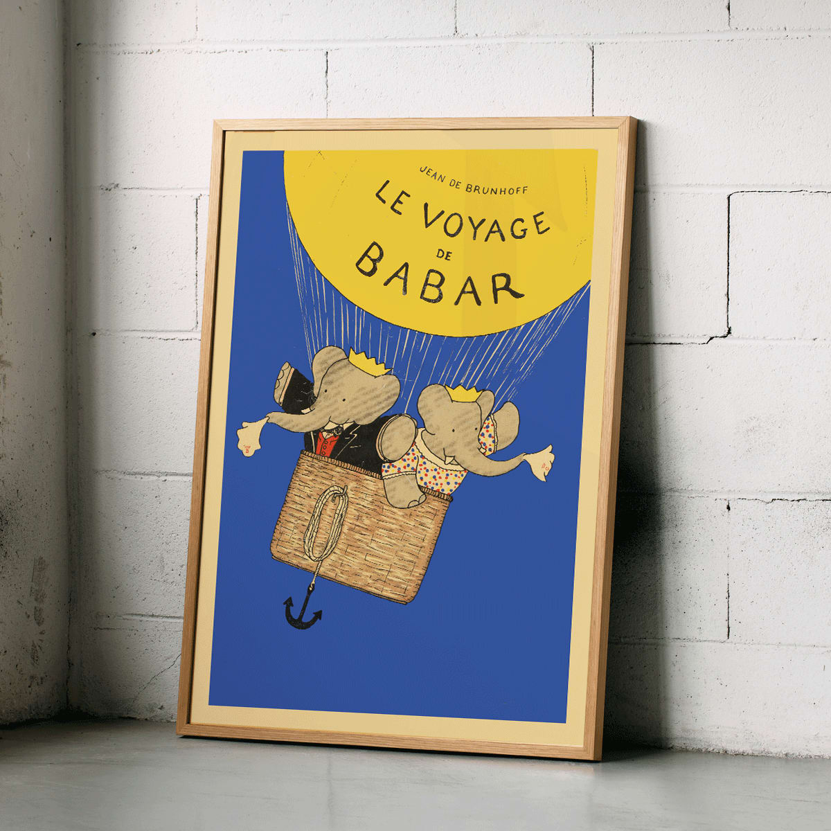 Le Voyage de Babar by Jean de Brunhoff illustration and poster featuring elephants in a hot air balloon with a yellow balloon on a blue background, framed and displayed in home decor