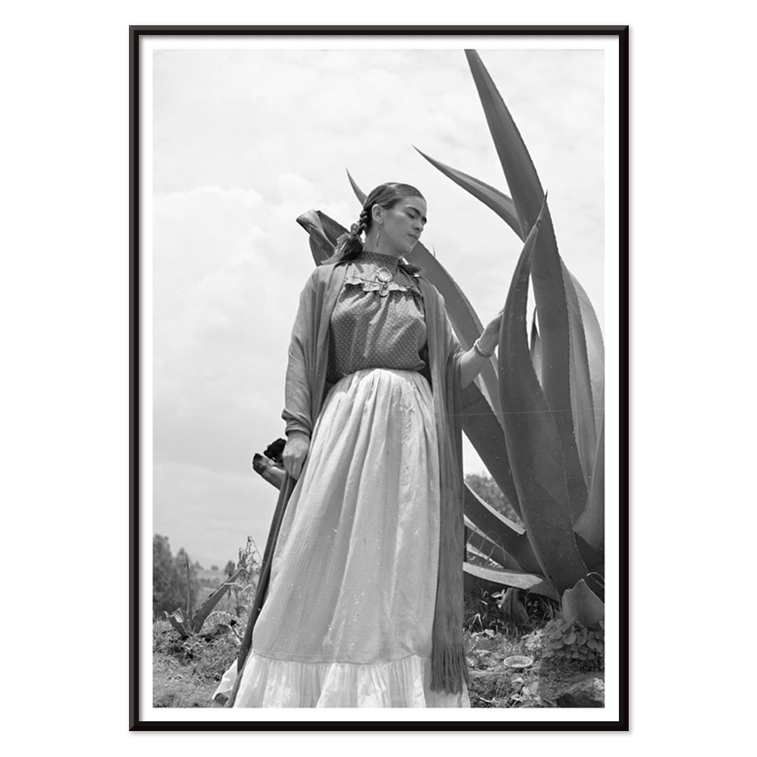 Frida Kahlo standing by agave plant black and white photograph and poster by Toni Frissell titled Senora Diego Rivera, with black aluminium frame on white background