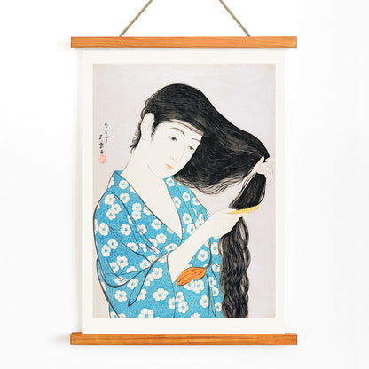 Woman in blue floral kimono combing her long hair artwork Woman Combing Her Hair by Goyo Hashiguchi Japanese art poster, with wooden magnetic frame on white background