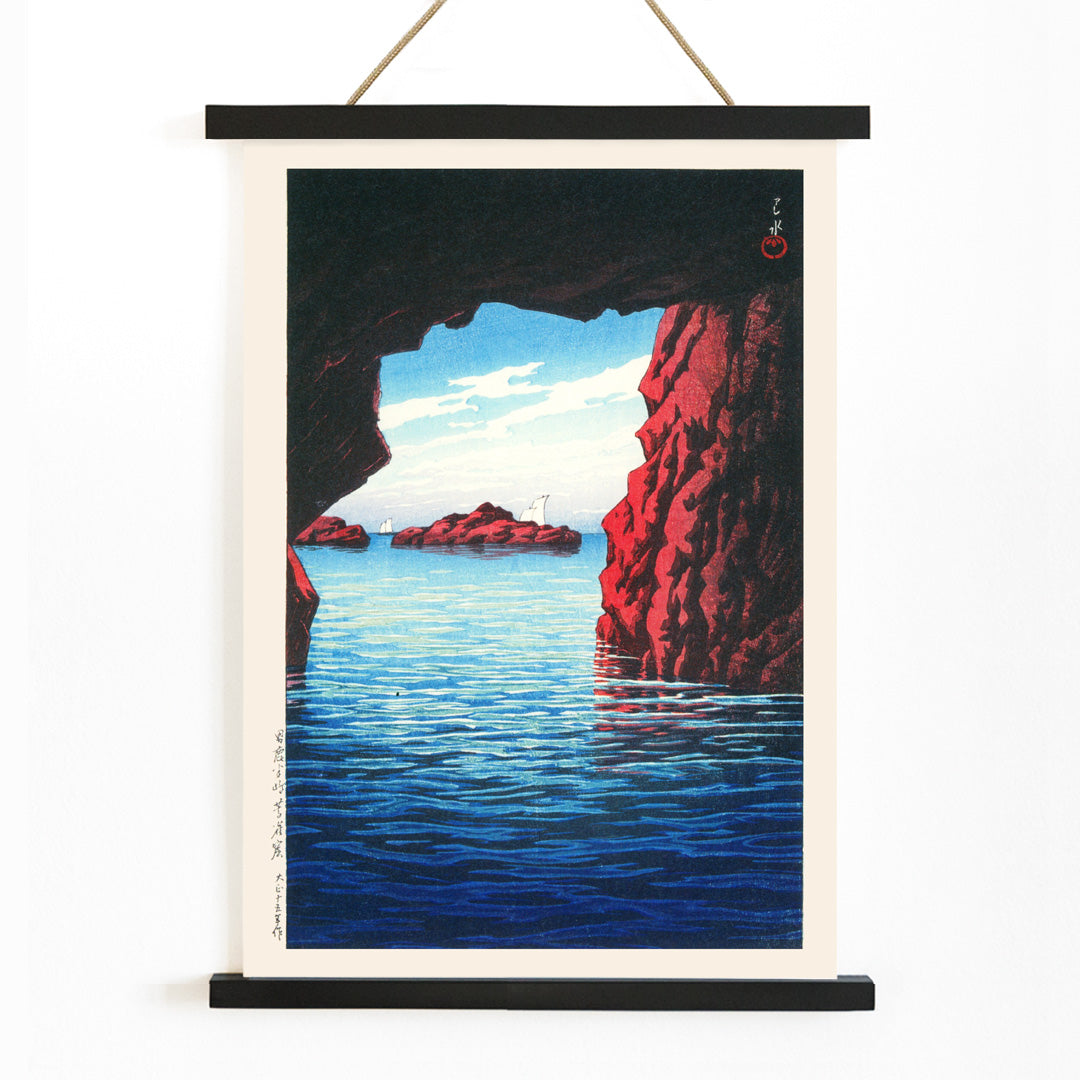 Kojaku Cavern Oga Peninsula sea cave with blue water and red cliffs vibrant sea cliffs and water by Kawase Hasui, with wooden magnetic frame on white background