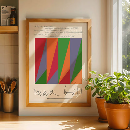 Colorful geometric design and shapes by Max Bill on serigraph silkscreen exhibition poster titled Serigraph Silkscreen with signature in black frame, framed and displayed in modern living room decor