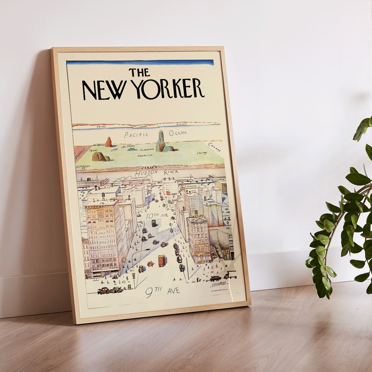 The New Yorker poster by Saul Steinberg featuring a whimsical stylized cityscape and landscape with 9th and 10th Avenue, framed and displayed in modern living room decor