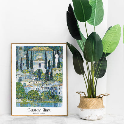 Kirche in Cassone by Gustav Klimt colorful village and church landscape painting poster with trees and buildings reflected in water, framed and displayed in home decor