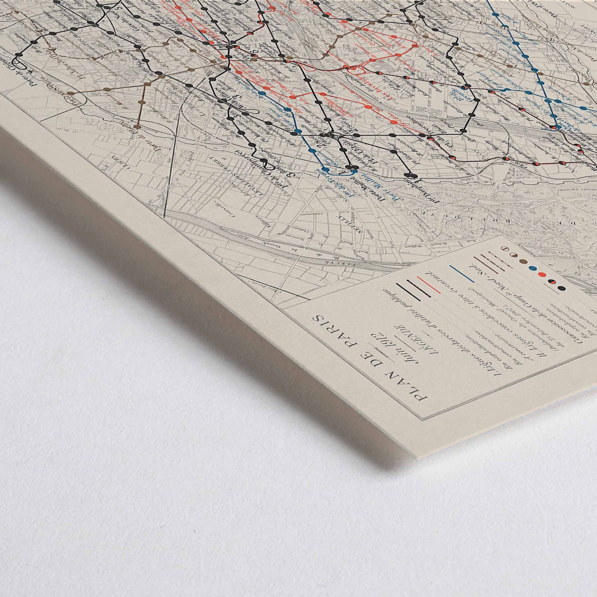 Closeup detail of Louis Wuhrer Paris metro map poster vintage city plan with black and red rail lines