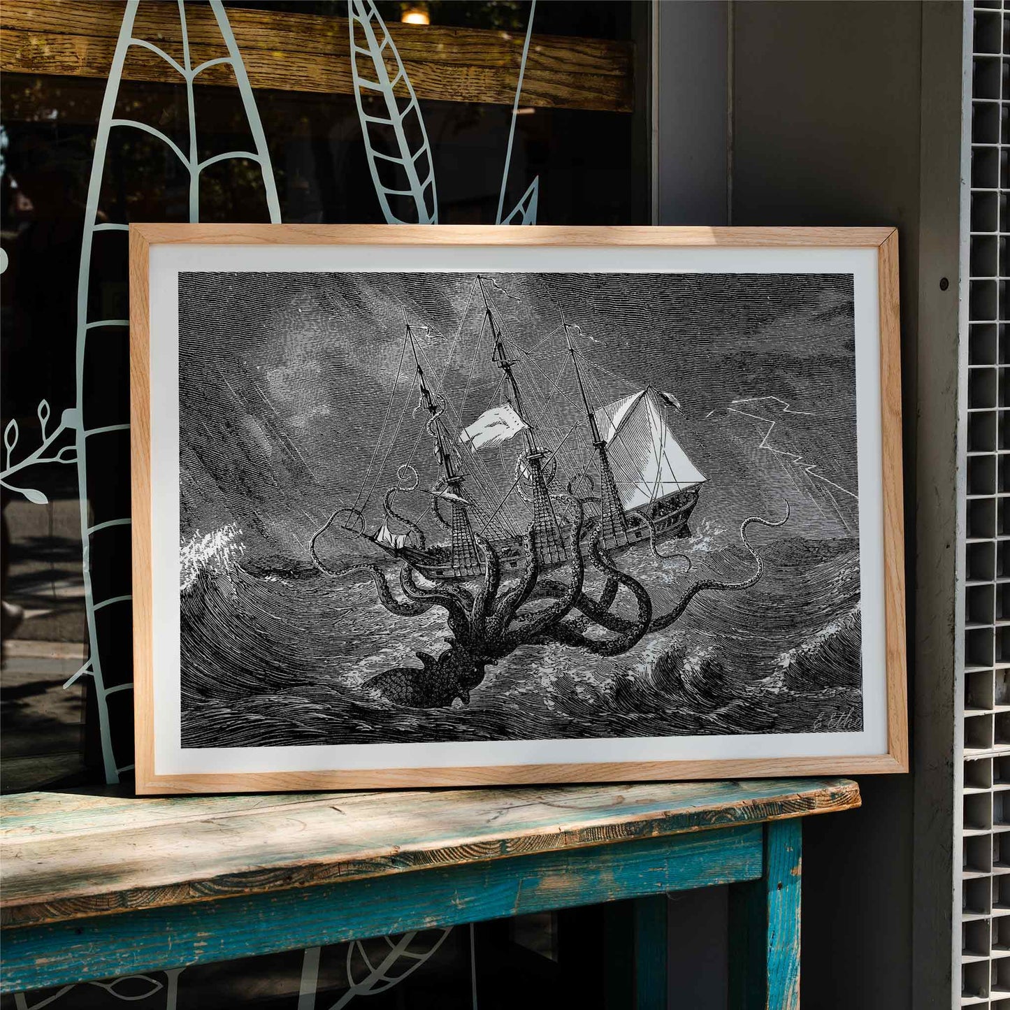 The Kraken attacking a ship in stormy seas sea monster poster titled The Kraken as seen by the eye of imagination, framed and displayed in home decor