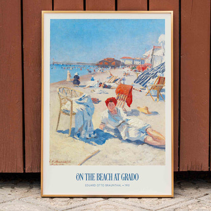 People relaxing on a sunny beach with chairs buildings and colorful umbrellas On the Beach at Grado by Eduard Otto Braunthal, framed and displayed in home decor