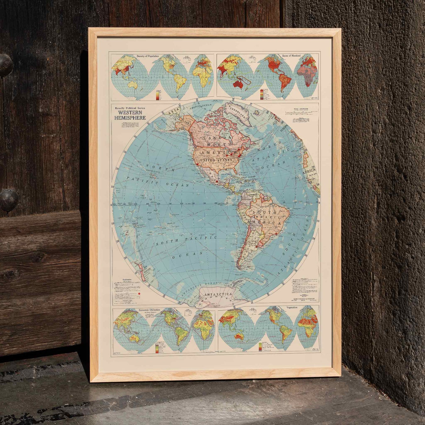 Western Hemisphere map by Rand McNally and Co showing detailed continents oceans and political geographic features, framed and displayed in home decor