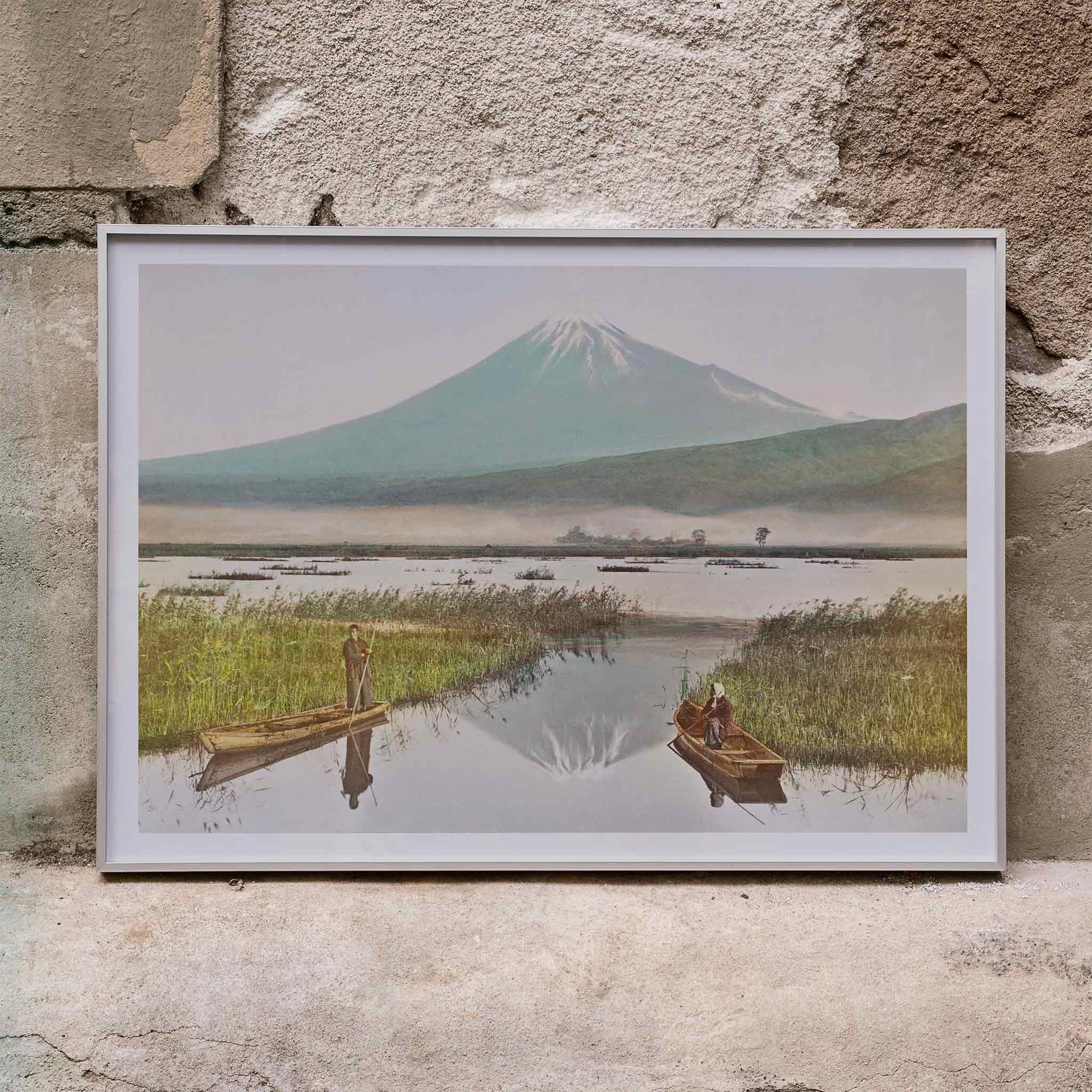 Mount Fuji from Kashiwabara with boats on tranquil lake hand colored albumen print and poster by Kazumasa Ogawa, framed and displayed in home decor