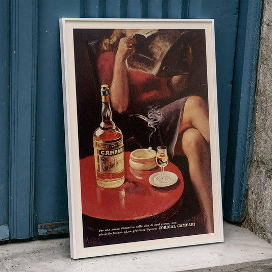 Cordial Campari vintage posters by Miroglio and Nizzoli featuring women relaxing with drinks magazines and bottles, framed and displayed in home decor