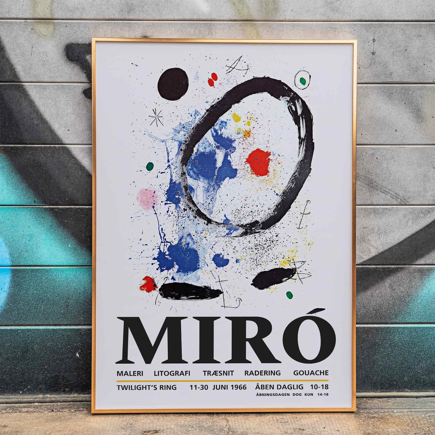 Twilights Ring exhibition poster inspired by Joan Miro featuring abstract artwork with bold colors and shapes, framed and displayed in home decor
