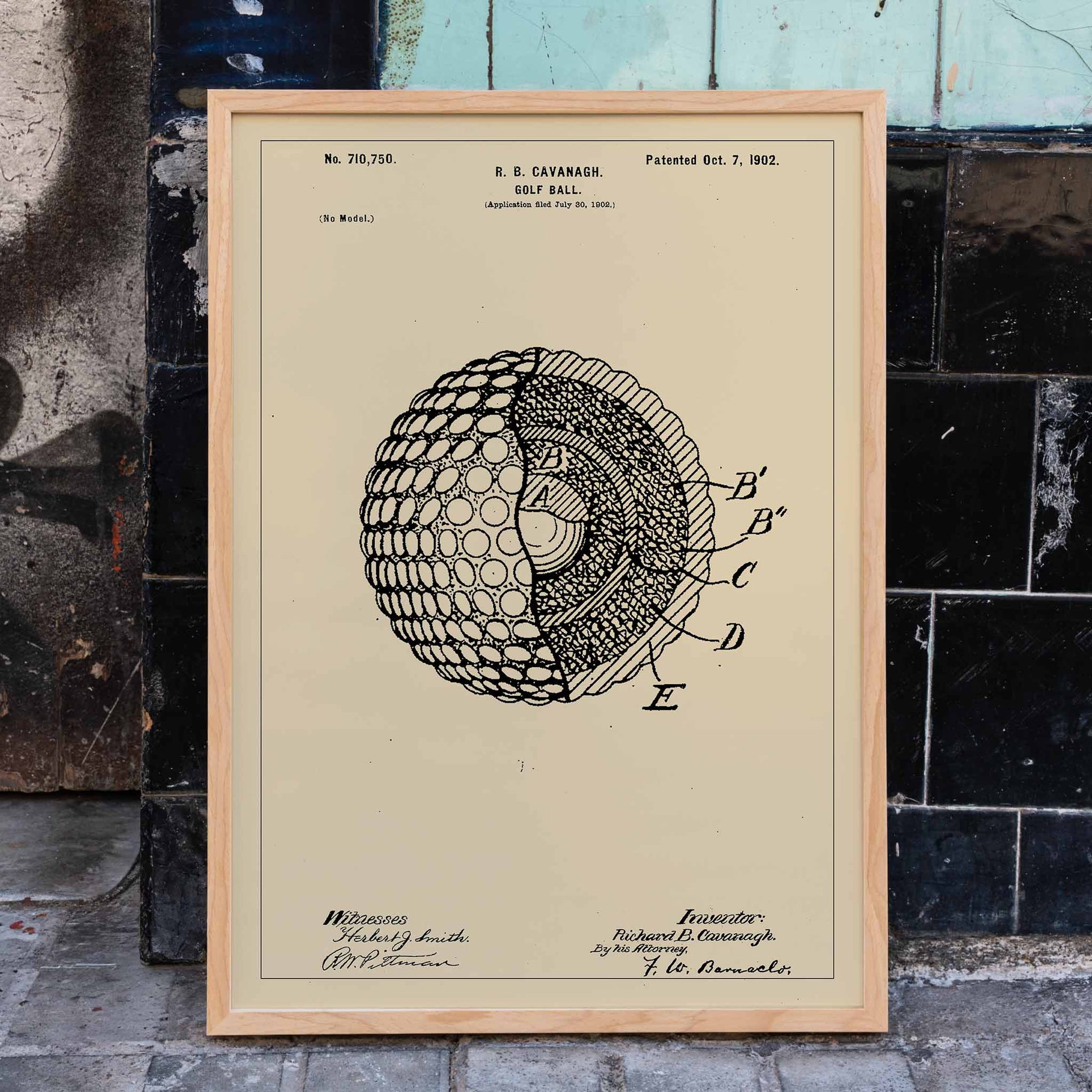 Golf ball patent technical drawing by R B Cavanagh showing detailed labeled interior structure and design elements, framed and displayed in home decor
