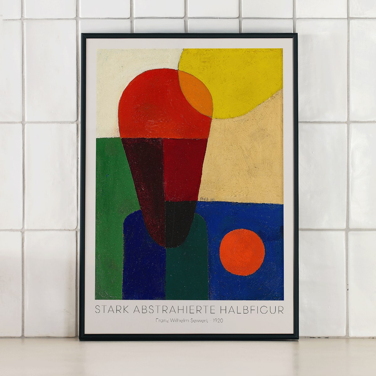 Colorful abstract geometric art poster titled Stark abstrahierte Halbfigur by Franz Wilhelm Seiwert, framed and displayed in modern living room decor