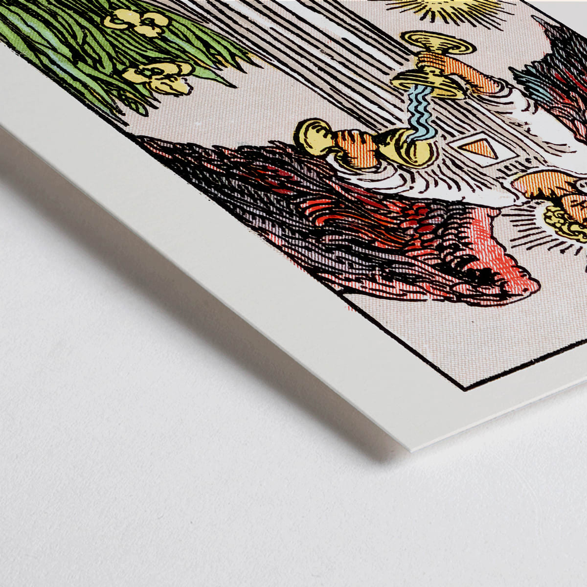 Closeup detail of Temperance tarot card by Rider Waite featuring an angel with wings pouring liquid between two cups illustration and poster