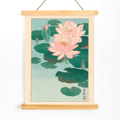 Poster of pink water lilies and green lily pads on calm pond from Flowering Water Lily by Ohara Koson, with wooden magnetic frame on white background