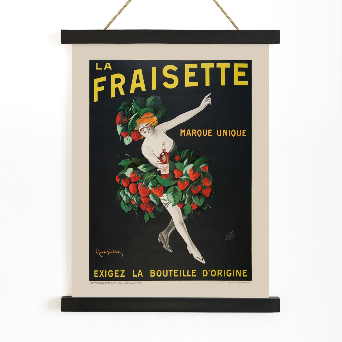 The Fraisette by Leonetto Cappiello poster featuring a whimsical woman in a strawberry costume holding a bottle of liqueur against a black background, with wooden magnetic frame on white background