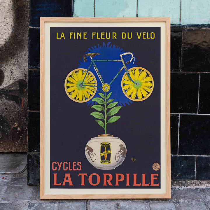Michel Liebeaux La fine fleur du vélo poster with yellow bicycle rising from flower pot, green plant, dark background, vintage advertising style, framed and displayed in modern living room decor